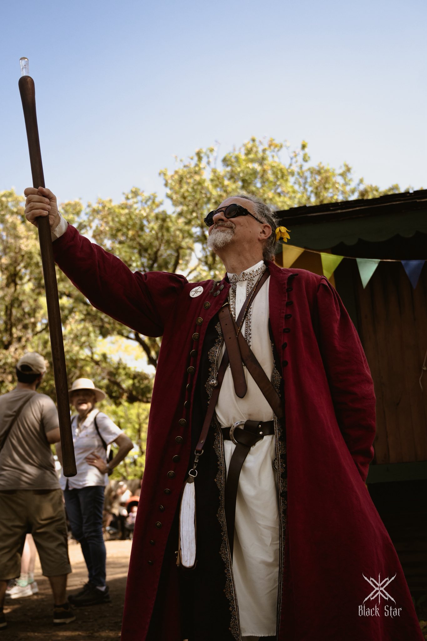 Mossbeard raising his staff to the sky